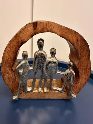 a metal figurine of a family in front of a mirror at City Center Acropolis area Maisonette Modern House in Athens