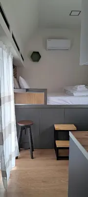 a bedroom with two bunk beds and a table at Panormou Cityview Loft in Athens