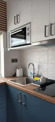 a kitchen with a sink and a microwave at Panormou Cityview Loft in Athens