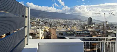 a view of a city from the balcony of a building at Panormou Cityview Loft in Athens