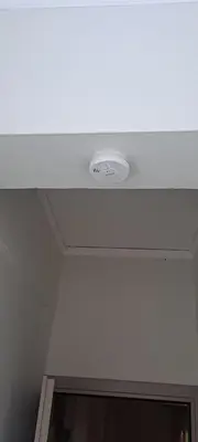a white ceiling with a light in a room at Urban Nest Apartments in Athens