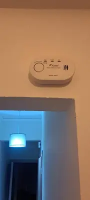 a remote control on a wall next to a door at Urban Nest Apartments in Athens