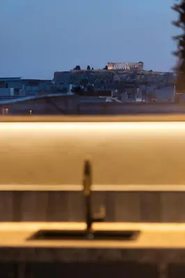 a train is speeding by in a blurry picture at Aristotelus Studio Jacuzzi & Acropolis View in Athens