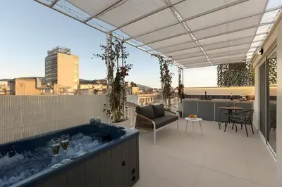 a hot tub on the roof of a house at Aristotelus Studio Jacuzzi & Acropolis View in Athens