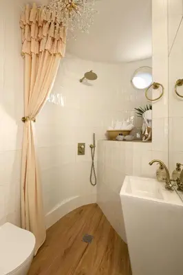 a bathroom with a shower curtain and a sink at Aristotelus Studio Jacuzzi & Acropolis View in Athens