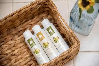 a basket with four bottles of moisturizers in it at In the Heart of the Port Area in Piraeus