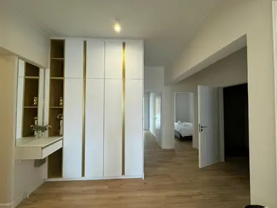 a room with a white closet and a bedroom at Harbour Getaway in Piraeus