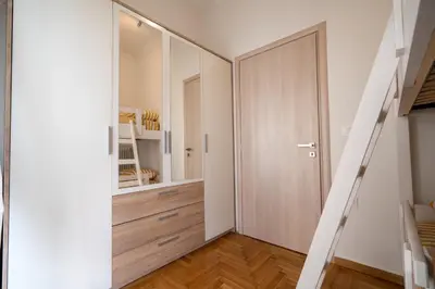 a hallway with a sliding door and a staircase at Athens Center 2 BDR Family Apartment at Zografou ! in Athens