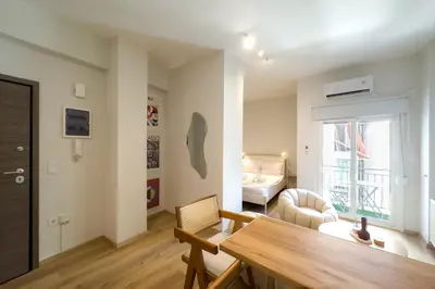 a living room with a table and a couch at City Wanderer Modern Loft in Athens