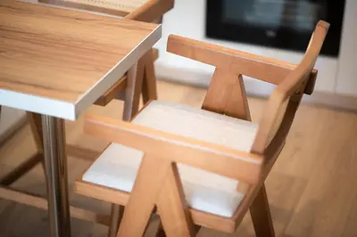 a pair of wooden chairs sitting at a table at City Wanderer Modern Loft in Athens