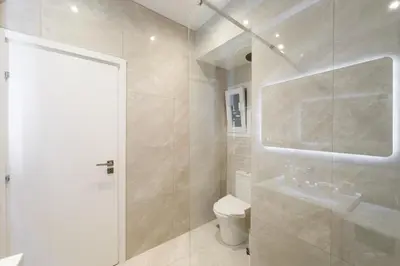 a bathroom with a shower and a toilet and a sink at City Wanderer Modern Loft in Athens