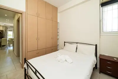 a bedroom with a bed with towels on it at Acropolis Nest in Athens
