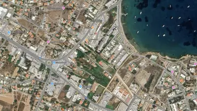 an overhead view of a city with a road and water at Home by the Sea in Porto Rafti in Porto Rafti