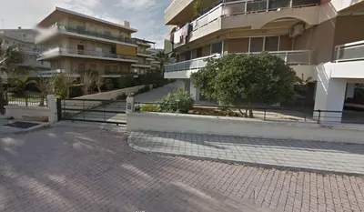 a brick street in front of a building at Home by the Sea in Porto Rafti in Porto Rafti