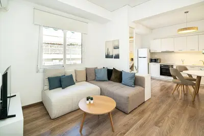 a living room with a couch and a table at Athens Casa Dell 'Imperatore in Athens