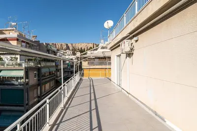 a balcony of a building with a walkway at Athens Casa Dell 'Imperatore in Athens