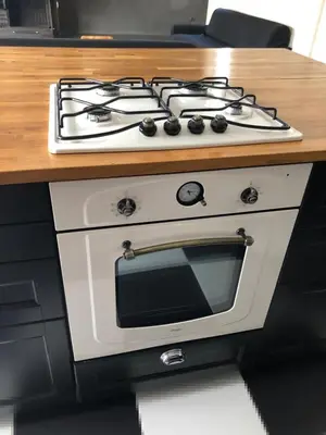 a white stove top oven sitting on top of a counter at Luxurious apartment with big balconyBEST location in Athens