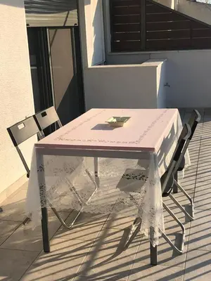 a pink table and two chairs on a patio at Luxurious apartment with big balconyBEST location in Athens