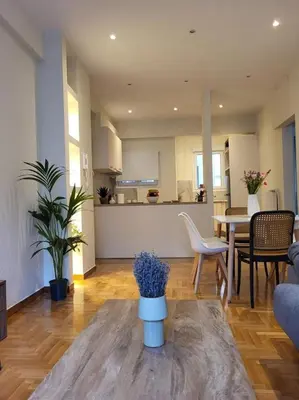 a living room with a couch and a table at 2 bd renovated flat at acropolis in Athens
