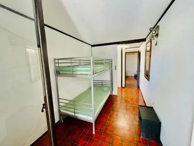 two bunk beds in a room with a hallway at Villa Pharaoh Private Pool Near the Beach in Porto Rafti
