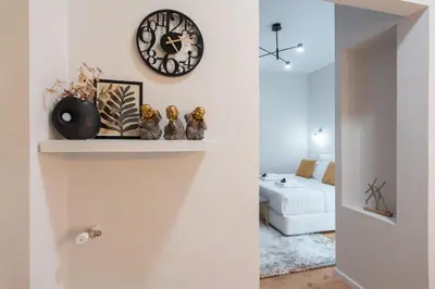 a living room with a clock on the wall at 