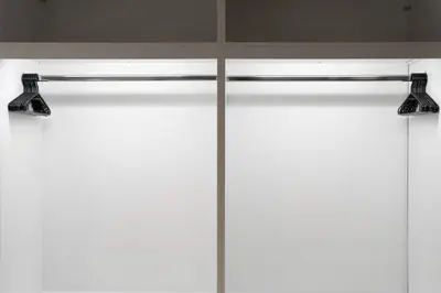 two lights on a curtain rod in front of a window at 
