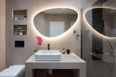 a bathroom with a white sink and a mirror at 