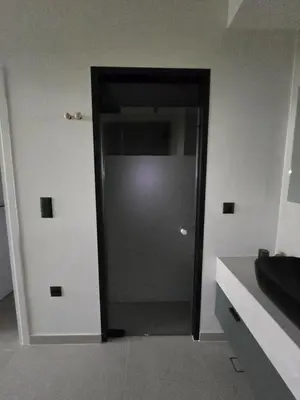 a hallway with a door in a room at Spacious Minimalistic Loft ,5 minutes walk to Metro in Athens