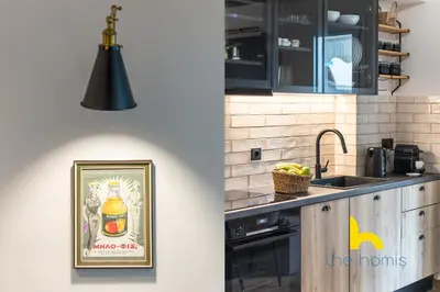 a kitchen with a picture of a bottle of sauce at Kaimaki in Athens