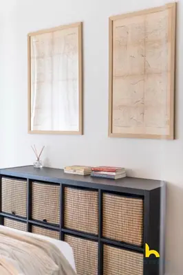 a bedroom with a black dresser with two windows at Kaimaki in Athens