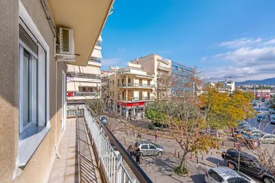 a view of a city from a balcony of a building at Rizes Suites Metro Dafni in Athens