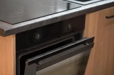 a stove top oven with a counter top at Stylish & Elegant Apt in Pagrati in Athens