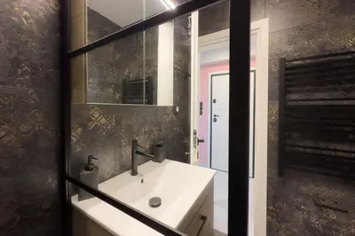 a bathroom with a sink and a mirror at Stylish & Elegant Apt in Pagrati in Athens