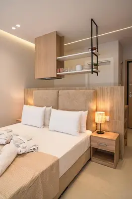 a bedroom with a large bed with white pillows at Urban Athens Gem in Athens