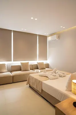 a bedroom with a large bed and a couch at Urban Athens Gem in Athens