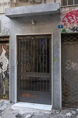 a door of a building with graffiti on it at Urban Athens Gem in Athens