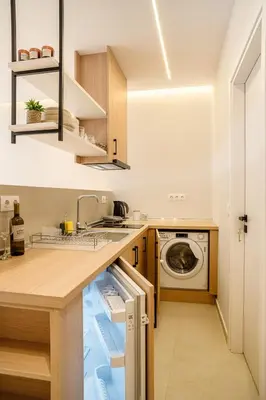 a kitchen with a sink and a washing machine at Urban Athens Gem in Athens