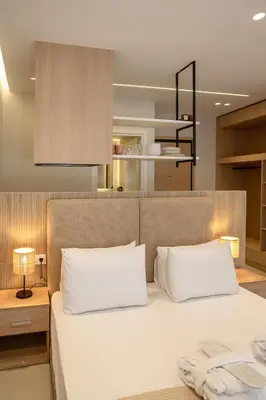 a bedroom with a bed with two white pillows at Urban Athens Gem in Athens