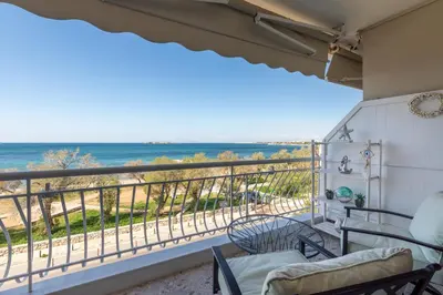 a balcony with a view of the ocean at Luxury Beachfront Paradise in Athens Rivieria Kavouri Vouliagmeni in Athens