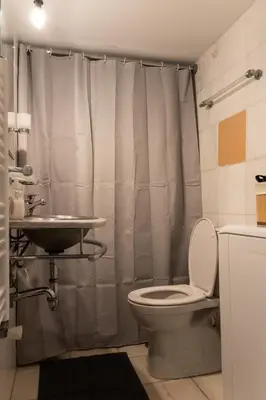 a bathroom with a toilet and a sink at South Glyfada Downtown49 Apartment in Athens