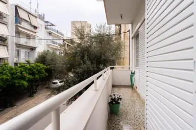a balcony with a view of a street at Neos kosmos Filimon in Athens
