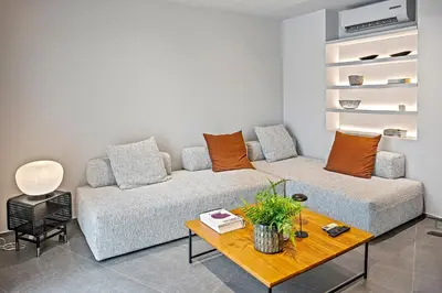 a living room with a couch and a table at Thissio Acropolis Historic Flat 1 in Athens