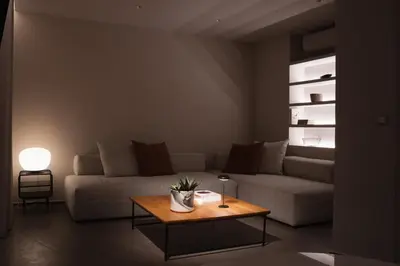 a living room with a couch and a table at Thissio Acropolis Historic Flat 1 in Athens