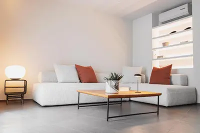 a living room with a couch and a coffee table at Thissio Acropolis Historic Flat 1 in Athens