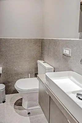 a bathroom with a white toilet and a sink at Thissio Acropolis Historic Flat 2 in Athens