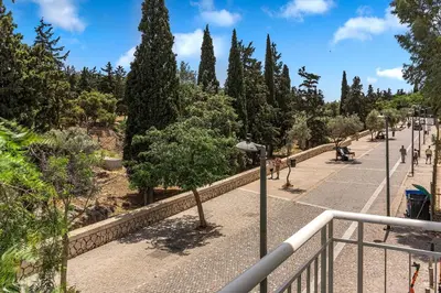 a walkway with trees on the side of a street at Thissio Acropolis Historic Flat 2 in Athens