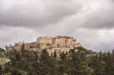 a castle on top of a mountain with trees at Thissio Acropolis Historic Flat 2 in Athens