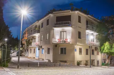a building on a street with a street light at Thissio Acropolis Historic Flat 2 in Athens