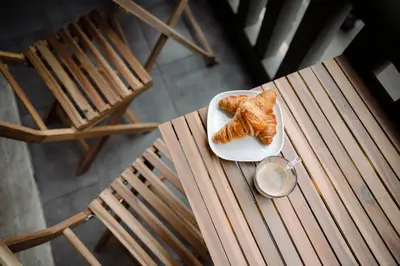 a plate of croissants sitting on top of a table at Acanthus Art Deco Retreat 250 from Metro & Archaeology Museum in Athens