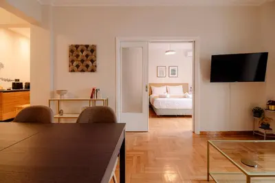 a living room with a bedroom with a bed at Acanthus Art Deco Retreat 250 from Metro & Archaeology Museum in Athens